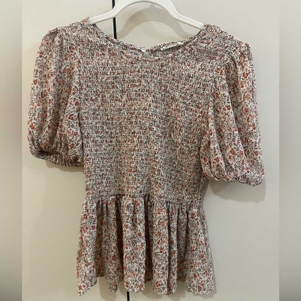 Floral peplum top with puff sleeve detail